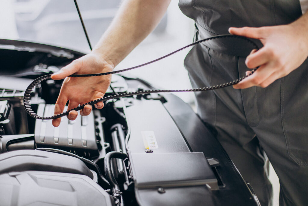 Repair man making car service